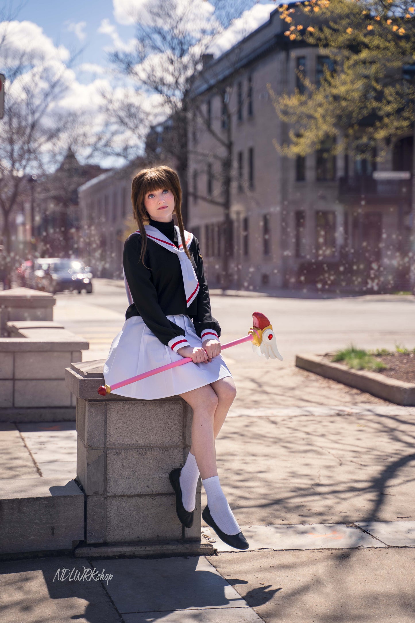 Cosplayer wearing a handmade Cardcaptor Sakura seifuku (sailor uniform) and holding her Sealing Wand, made using a sewing pattern from NDLWRKshop.