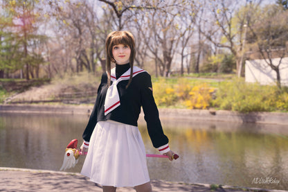 Cosplayer wearing a handmade Cardcaptor Sakura seifuku (sailor uniform) and holding her Sealing Wand, made using a sewing pattern from NDLWRKshop.