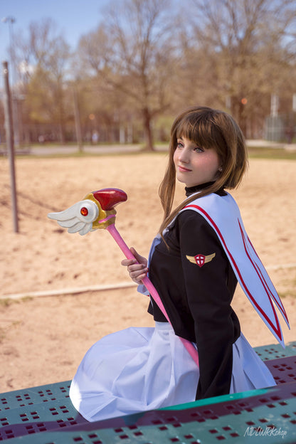 Cosplayer wearing a handmade Cardcaptor Sakura seifuku (sailor uniform) and holding her Sealing Wand, made using a sewing pattern from NDLWRKshop.