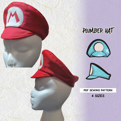 A red plumber hat with a white 'M' logo on a mannequin head, indicating the hat is designed to look like a character from a popular video game. The pattern is available in PDF format and comes in four sizes.