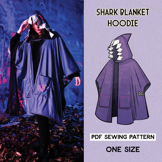 Split image showing a cosplayer wearing a blue &quot;shark blanket hoodie&quot; next to an illustration of the pattern design in purple. The hoodie features a shark-like hood with jagged &quot;teeth.&quot; The cosplayer is standing outdoors with graffiti in the background. Text indicates this is a PDF sewing pattern available in one size. The cosplayer wears the hoodie over a black outfit.